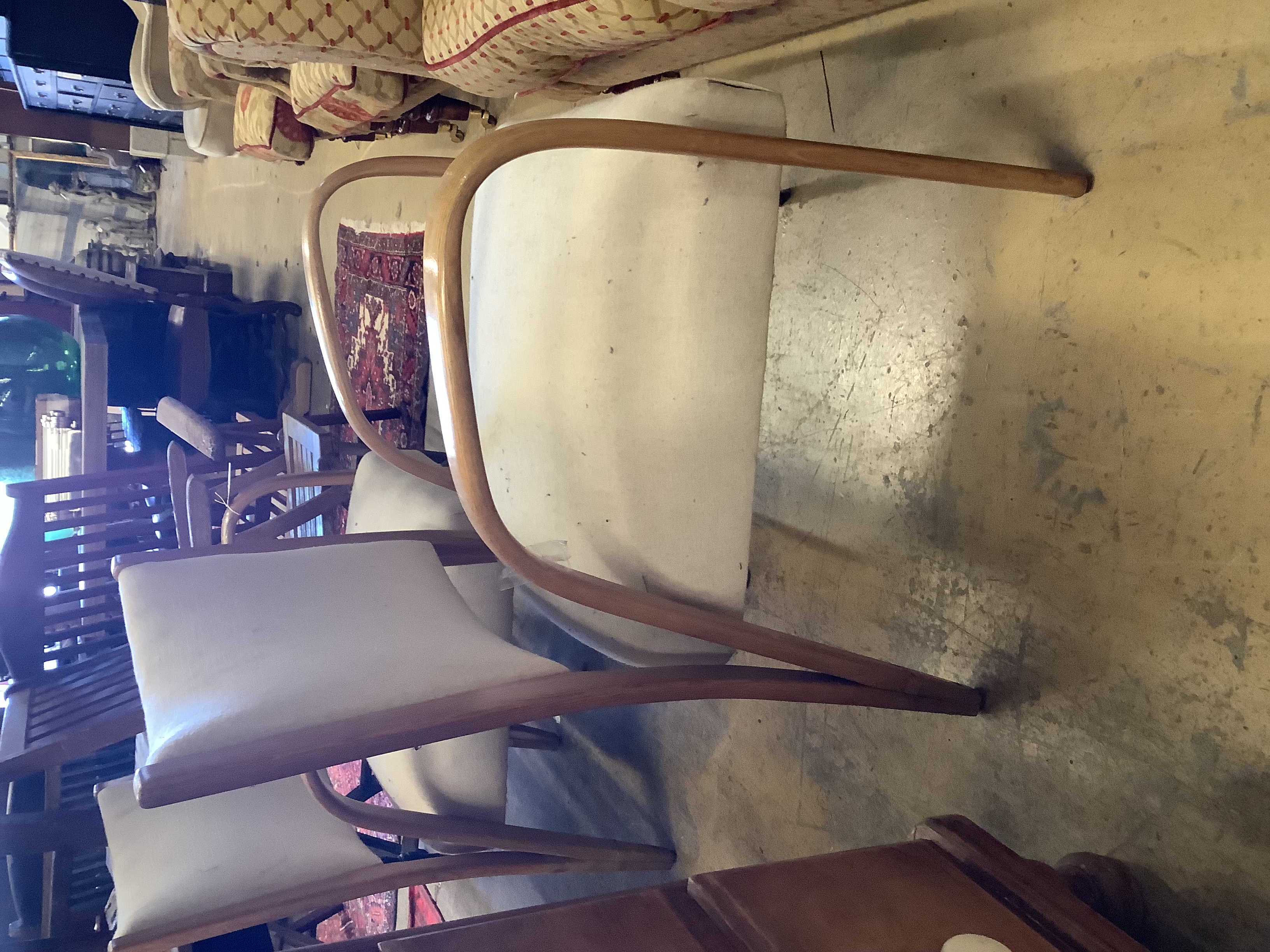 A pair of mid century elbow chairs